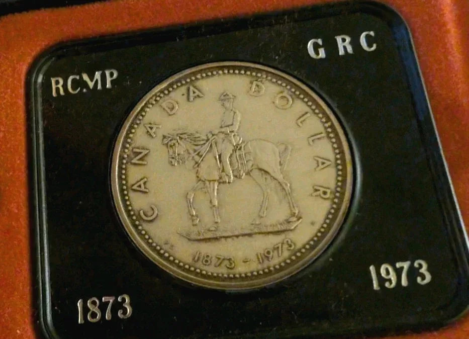 Two 1973 Cdn Silver Dollars - 1 Lightly Toned & 1 UNC - 100 years of RCMP - NumisFind